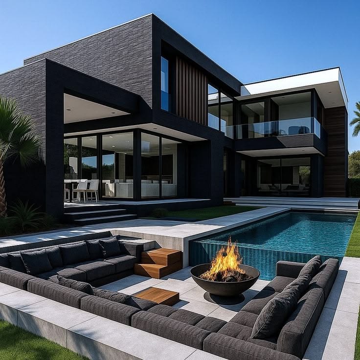 midnight luxe modern villa with poolside fire lounge